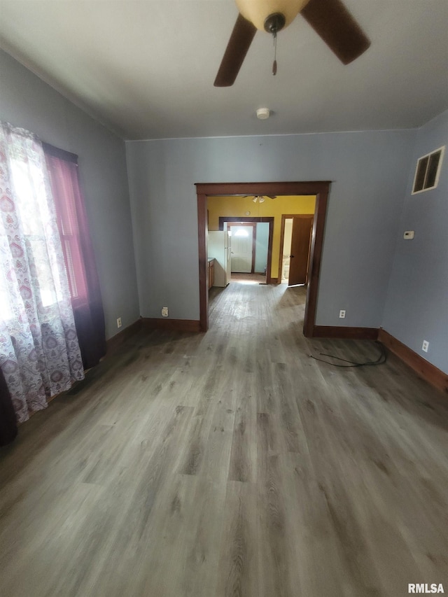 interior space featuring hardwood / wood-style floors and ceiling fan