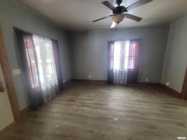 unfurnished room with wood-type flooring and ceiling fan