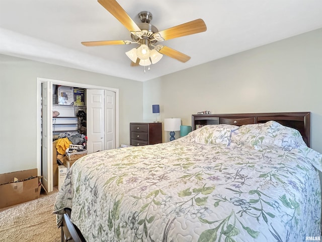 carpeted bedroom with a closet and a ceiling fan