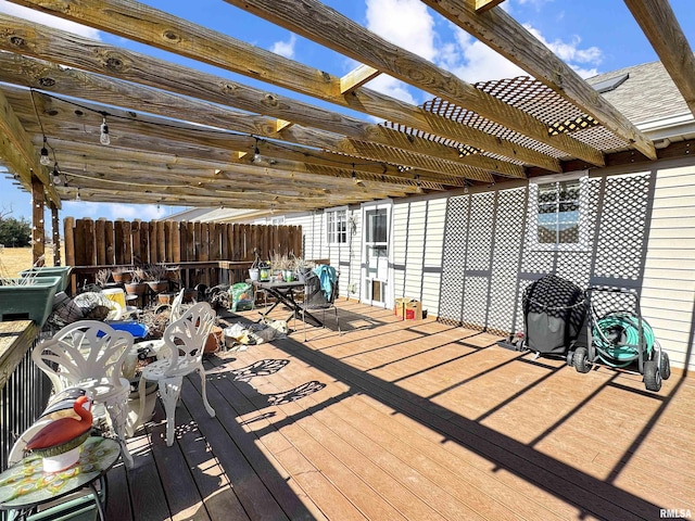 deck with fence and a pergola