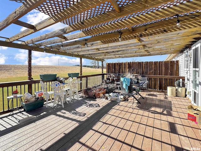 deck with outdoor dining area and a pergola