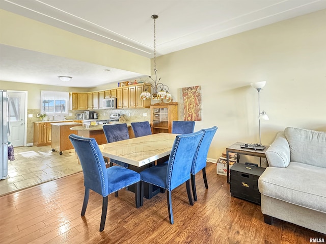 dining area with light wood-type flooring