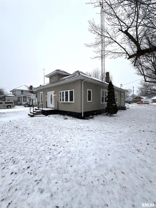 view of snow covered property