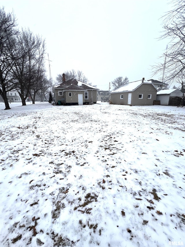 view of yard covered in snow