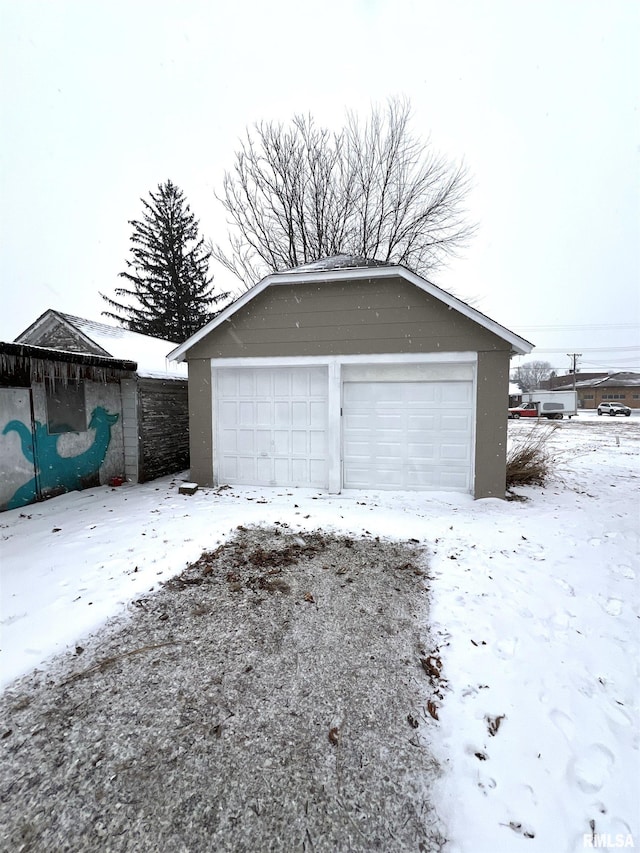 view of snow covered garage