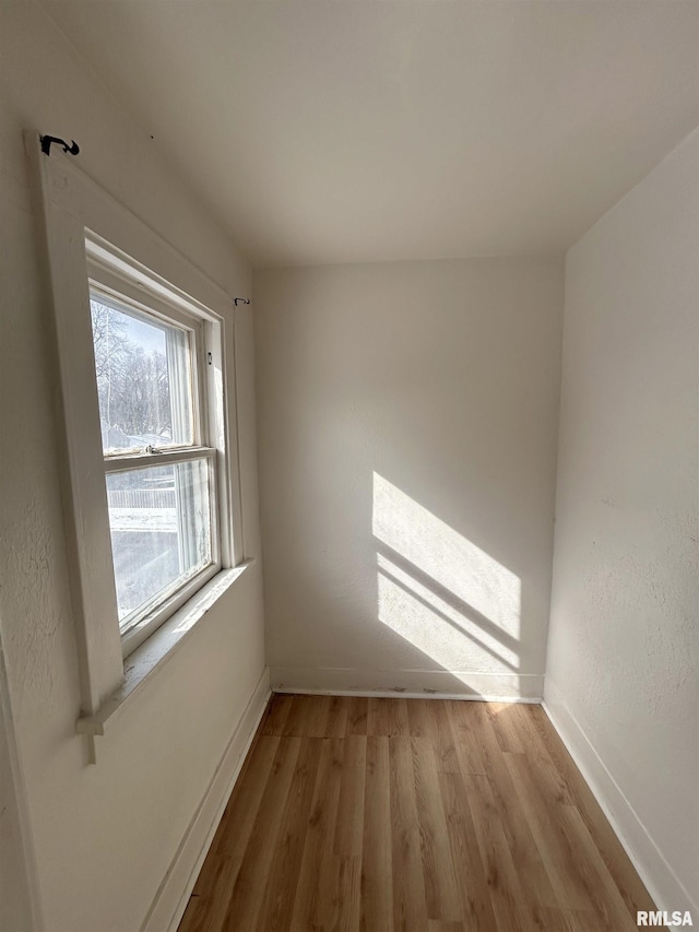 empty room with light hardwood / wood-style floors