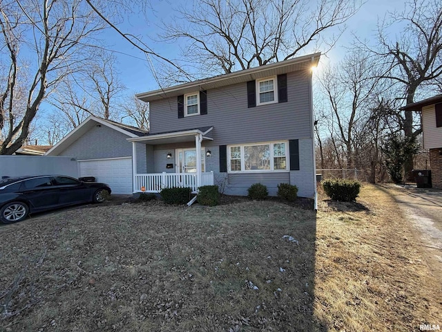 front facade featuring covered porch and a garage