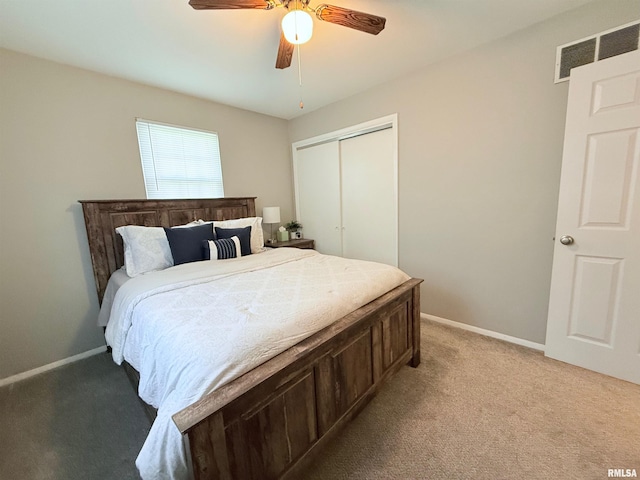 carpeted bedroom with a closet and ceiling fan