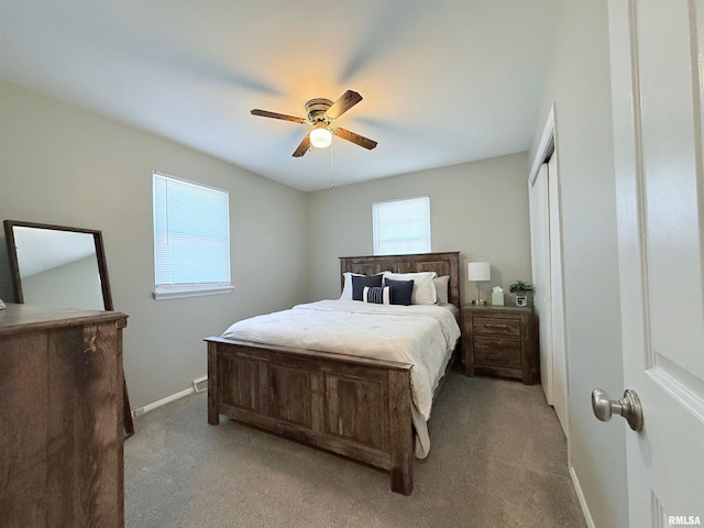 bedroom featuring light colored carpet and ceiling fan