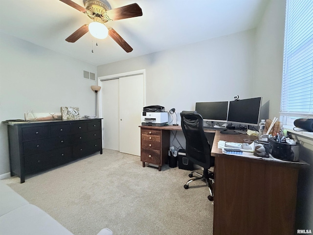 home office with light colored carpet and ceiling fan