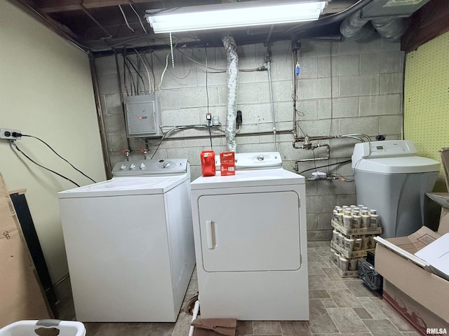 washroom featuring washing machine and dryer and electric panel