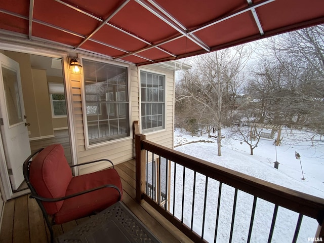 view of snow covered deck