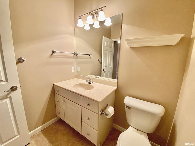 bathroom featuring toilet and vanity