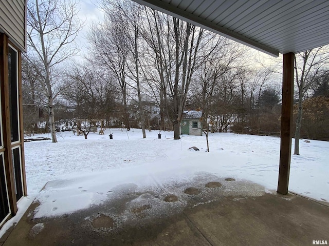 view of yard layered in snow