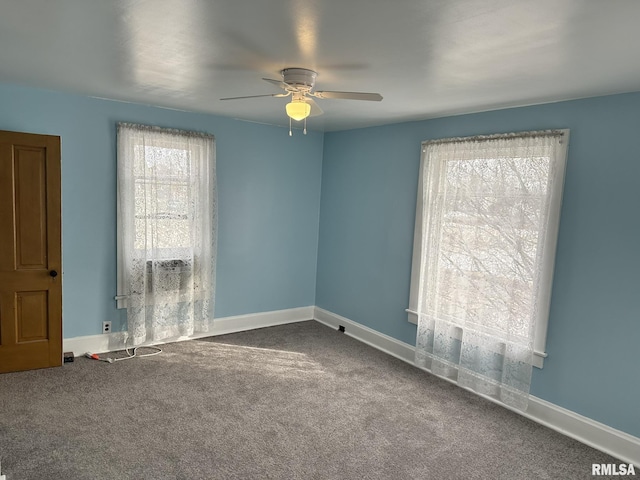 empty room featuring carpet floors and ceiling fan