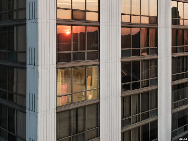 view of outdoor building at dusk