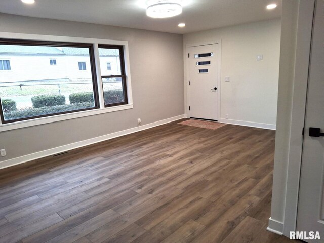 300 E 4th St, Saint David, IL 61563 - unfurnished room with dark wood-style floors, recessed lighting, and baseboards