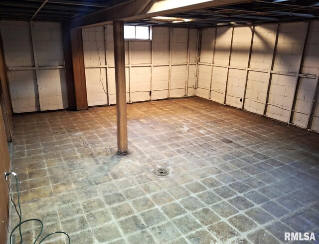 300 E 4th St, Saint David, IL 61563 - unfinished basement featuring concrete block wall and a fireplace