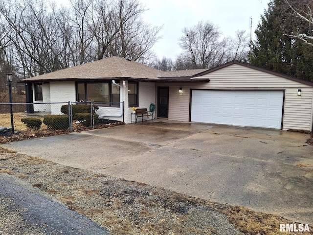 300 E 4th St, Saint David, IL 61563 - ranch-style house with fence, concrete driveway, a shingled roof, and an attached garage