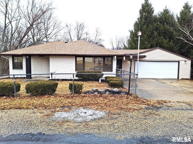 300 E 4th St, Saint David, IL 61563 - bungalow-style home with central AC, brick siding, a fenced front yard, and roof with shingles