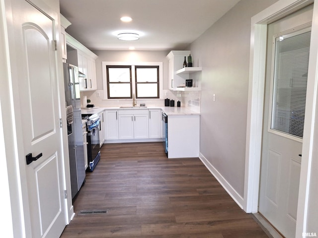 300 E 4th St, Saint David, IL 61563 - kitchen featuring range, light countertops, open shelves, and white cabinetry