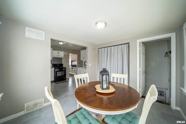 dining space with baseboards and visible vents