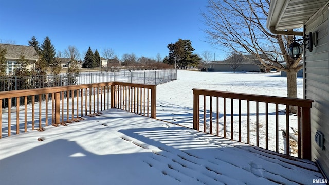 view of snow covered deck