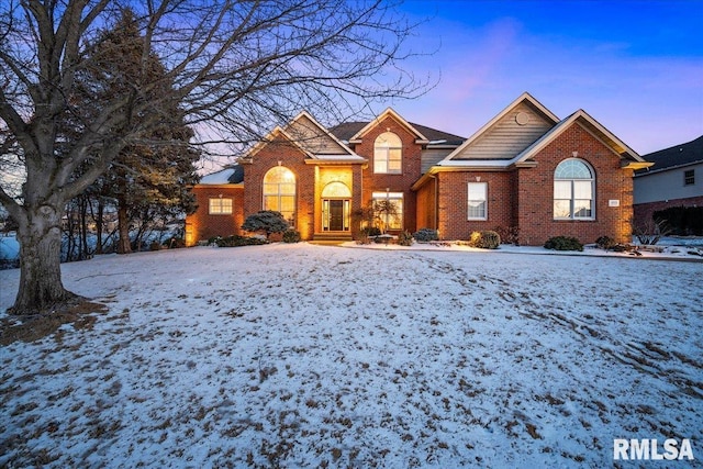 view of front of house featuring brick siding