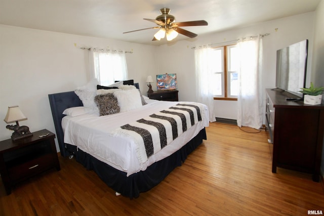 bedroom featuring wood finished floors and a ceiling fan