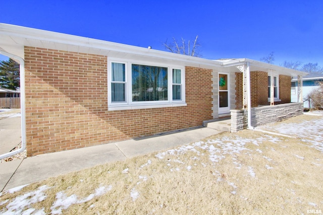 ranch-style home with brick siding