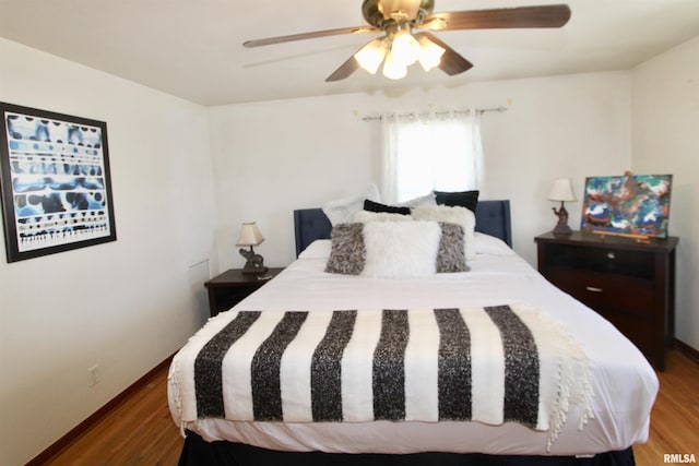 bedroom with a ceiling fan and wood finished floors