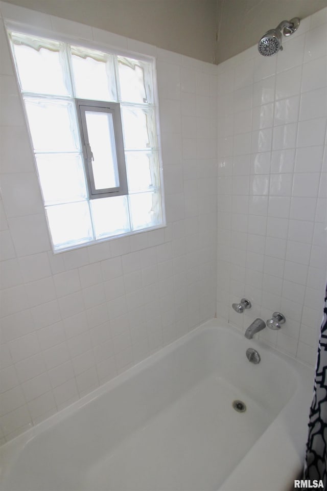 bathroom featuring shower / tub combo with curtain