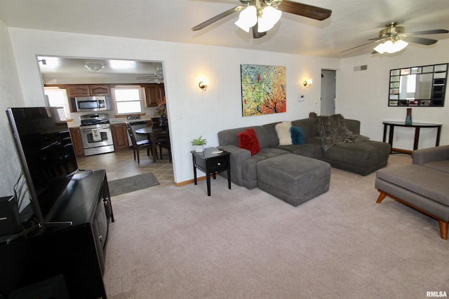 living room with light carpet and visible vents