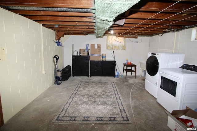 unfinished basement with washer and clothes dryer