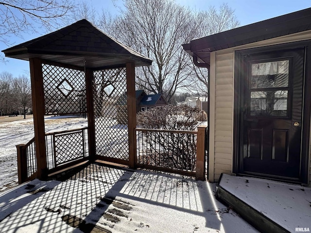 snow covered deck featuring a gazebo