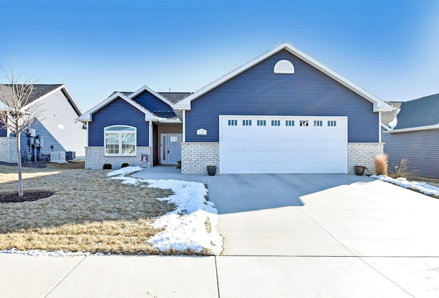 ranch-style home with driveway and an attached garage