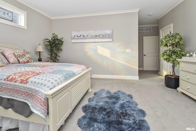 bedroom with baseboards, crown molding, visible vents, and light colored carpet