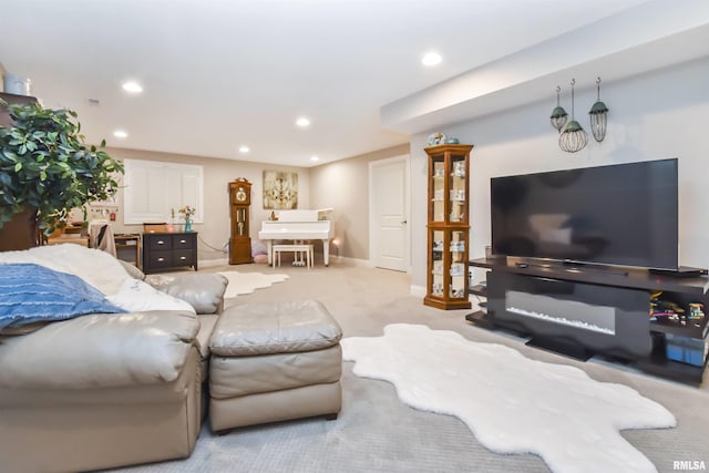 living room with baseboards, light carpet, and recessed lighting