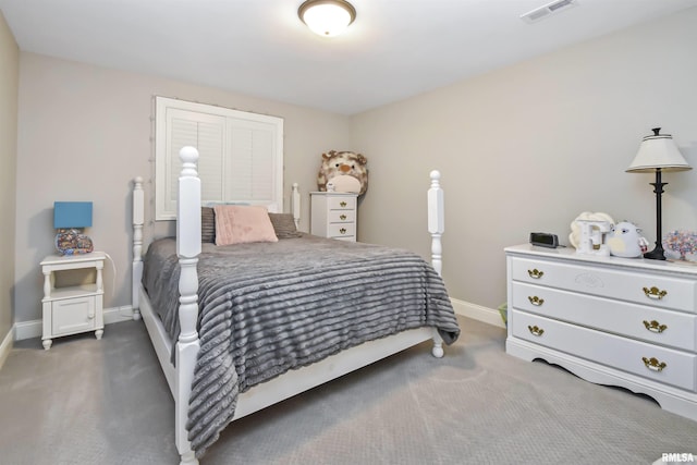 bedroom featuring visible vents, dark carpet, and baseboards