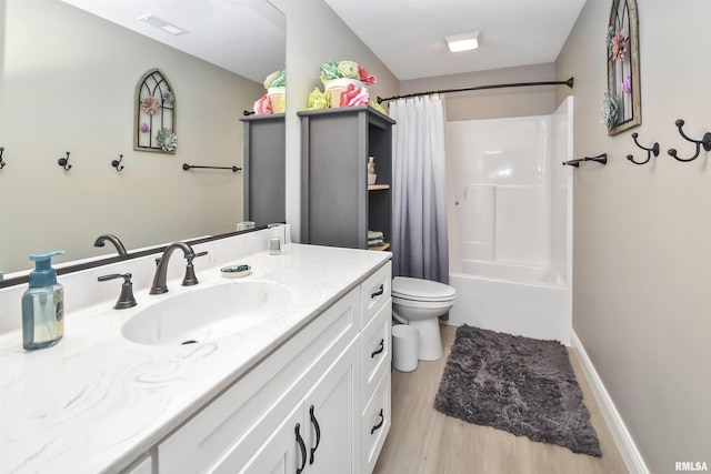 full bath featuring visible vents, toilet, wood finished floors, shower / bathtub combination with curtain, and vanity