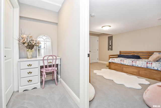 bedroom featuring baseboards and light colored carpet