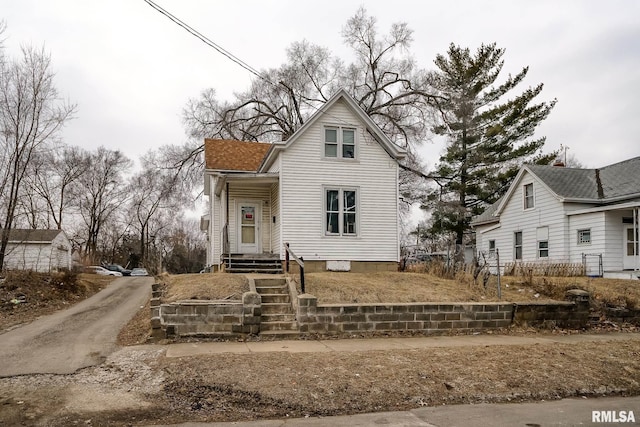 view of front of property with a shingled roof