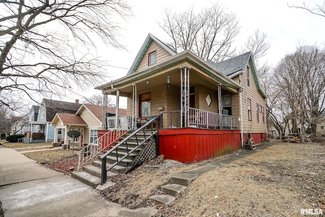 view of front facade with a porch and stairs