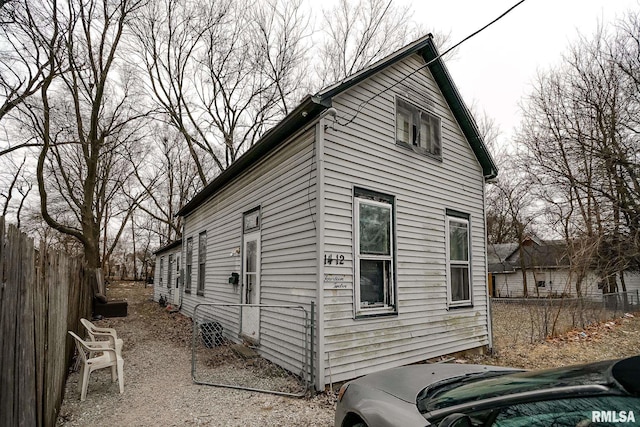 view of property exterior featuring fence