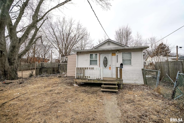 bungalow featuring a fenced backyard