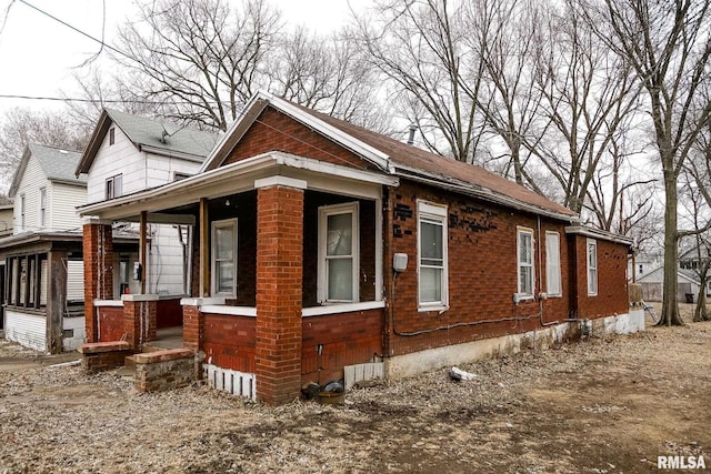 view of home's exterior with brick siding