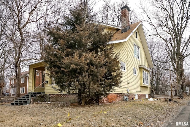 view of front of property featuring a chimney