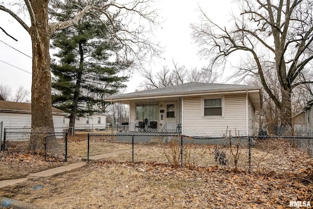 view of front of house with a fenced front yard and a porch