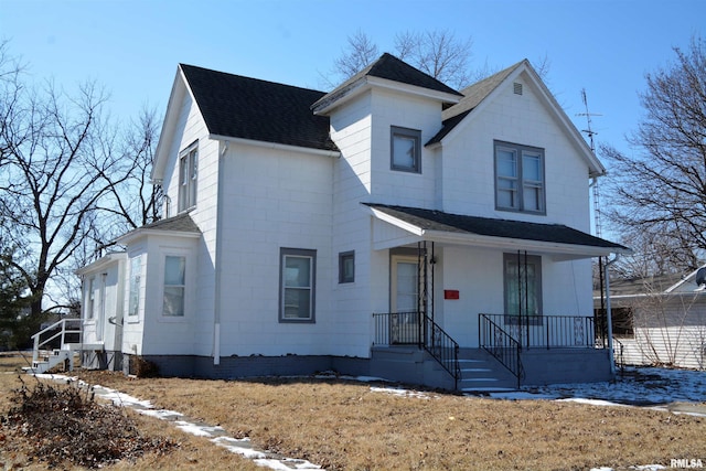 view of front of home featuring roof with shingles