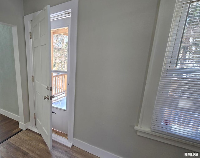 room details with baseboards and wood finished floors